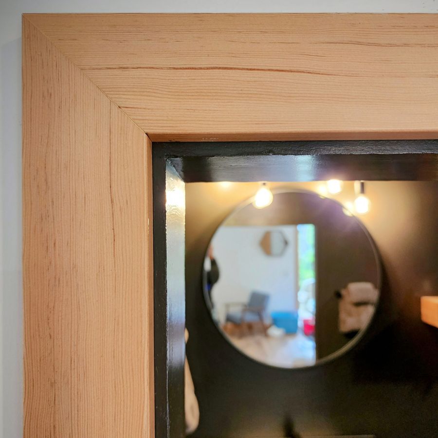 Fir door casing with a mitred corner, in a converted garage suite in Ucluelet.